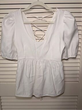 White Puff-Sleeve Peplum Tunic with Lace-Up Back